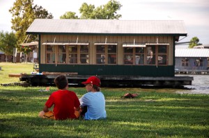 Boys by kayak cabin